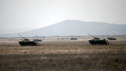 Russia Threatens Ukraine, Germany Appeases